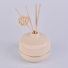 China round ceramic bottle in nude color with gold ring, ceramic diffuser bottles manufacturer