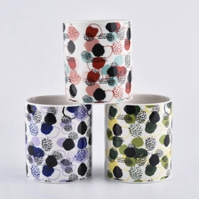 China colorful ceramic candle jars with printing all around the jars manufacturer