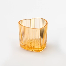 China Luxury Heart Shape Stripe Design Amber Glass Jar Candle Vessel for Candle Packaging manufacturer