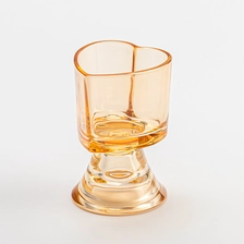 China Heart Shape Light Amber Glass Vessel Scented Candle Jars with Glass Base manufacturer