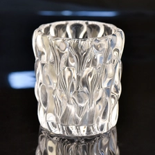China 8oz unique embossed high-white glass candle holder glass jar for hotel decoration manufacturer