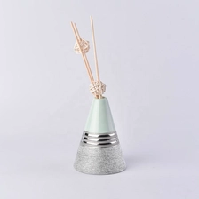 China Vintage silver Triangle oil essential reed diffuser ceramic bottle manufacturer