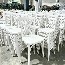 China Wedding Chair Hotel Outdoor White Plastic Cross Back Wedding Chairs X Back Plastic Cross Chair for Banquet Event Party manufacturer