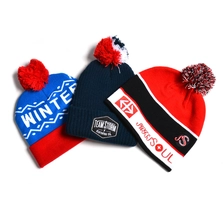 China jacquard logo effen gebreide pom pom wintermutsen fabrikant