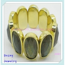 China Newest oval gold plated alloy dark yellow resin stone bangle bracelets manufacturer