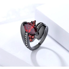 China Custom unique wave design black gold ruby gemstone finger ring for women manufacturer