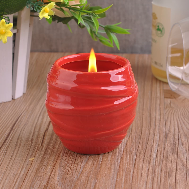 red glazing candle holders with spiral pattern