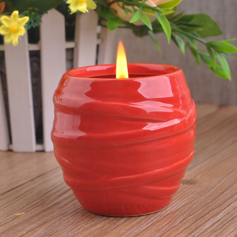 red glazing candle holders with spiral pattern