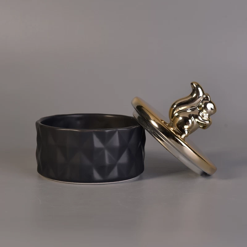 Matte black ceramic containers with gold animal lids