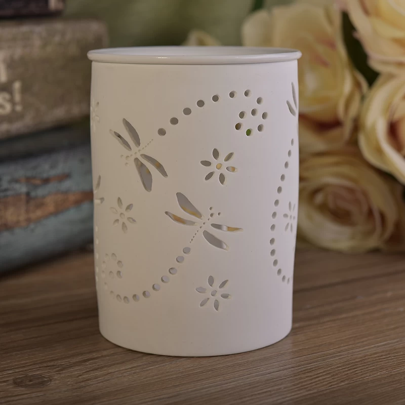 White ceramic candle burner with hellow out dragonfly pattern