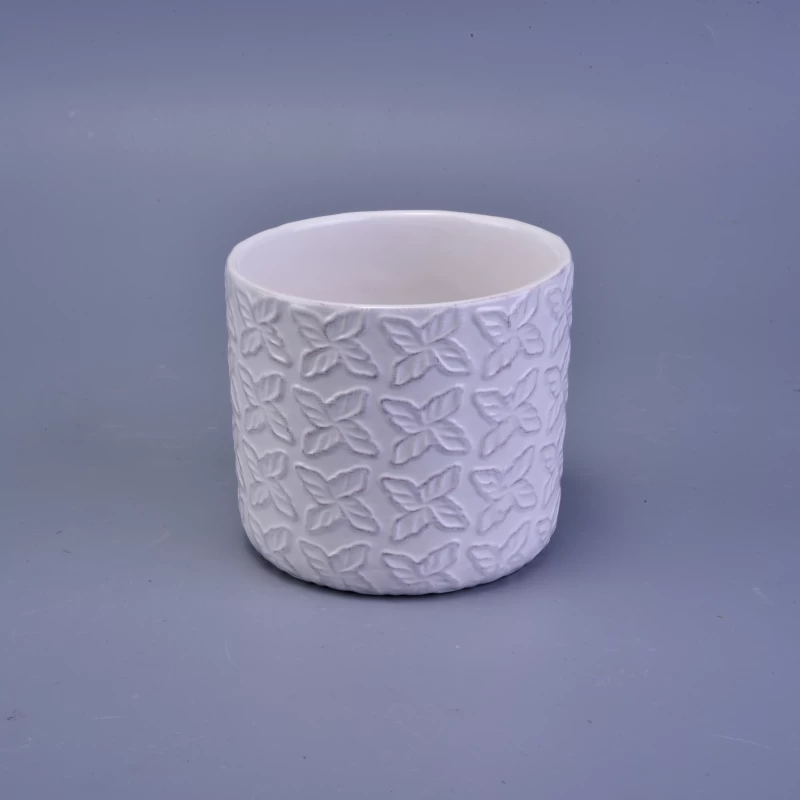 matte white ceramic candle holder with embossed pattern
