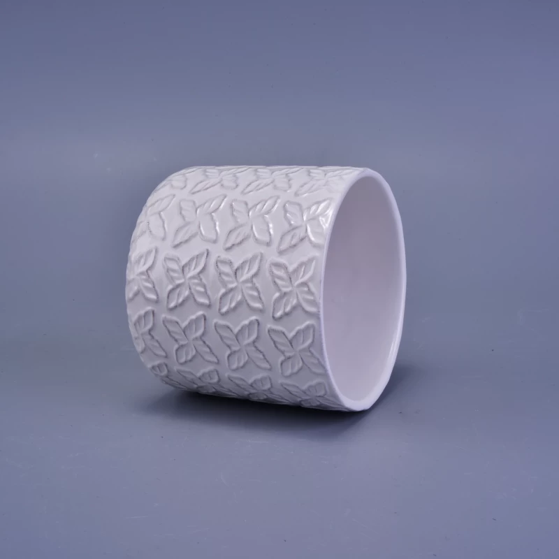 matte white ceramic candle holder with embossed pattern