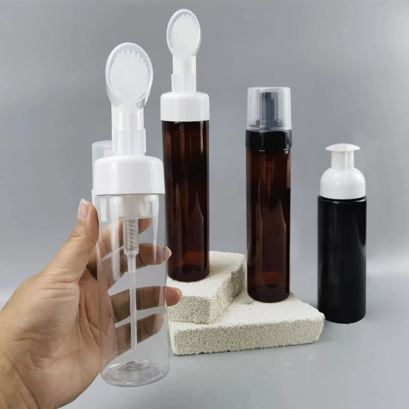 China Custom PET Clear Amber 180ml 200ml 250ml Plastic Facial Cleanser Soap Foaming Liquid Pump Bottle with Silicone Brushes manufacturer