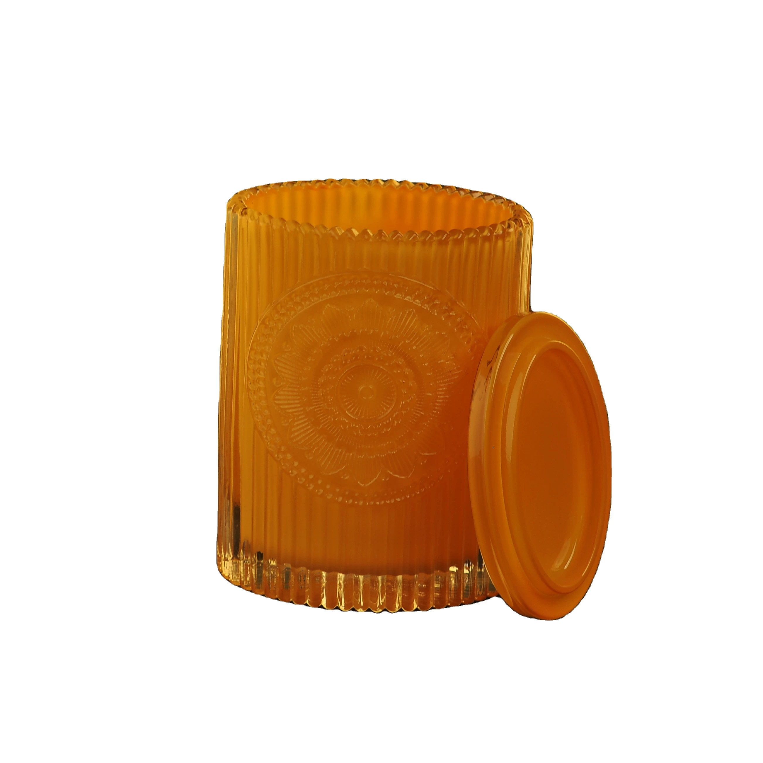 China Factory price luxury oval custom engraved color glass candle jars with lid manufacturer