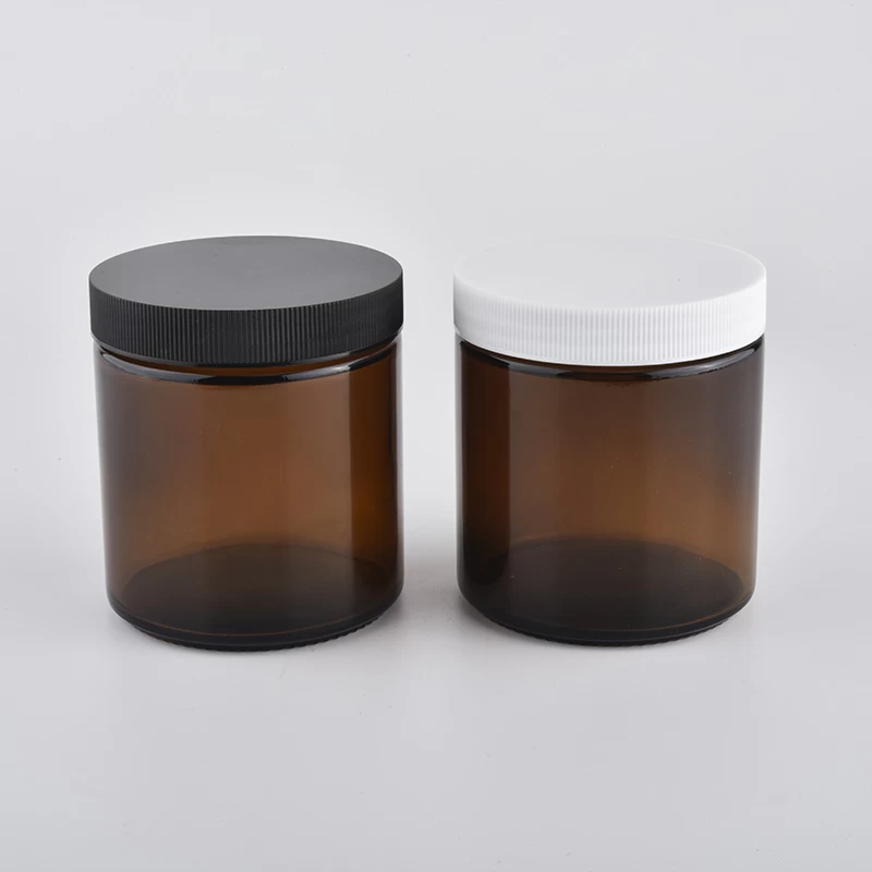 Amber colored Glass for candles with a black metal lids