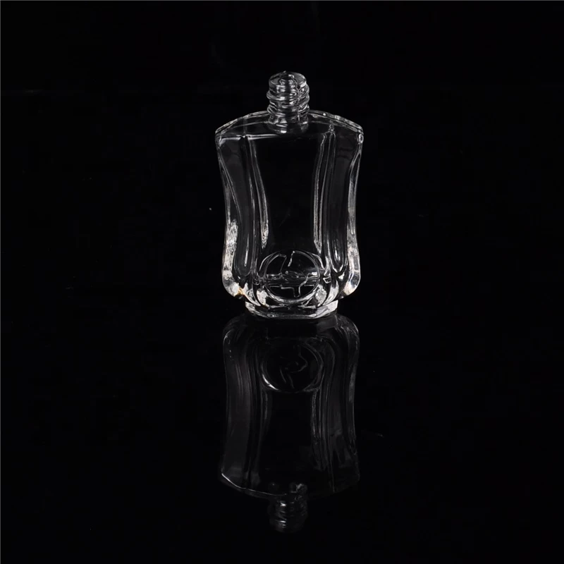 Mini empty glass container embossed oil perfume bottles supplier