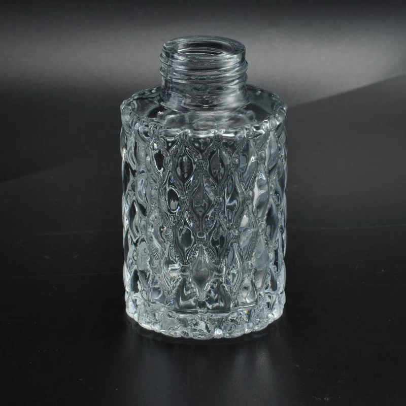 ODM Transparent embossed glass container oil essential perfume spray bottles factory