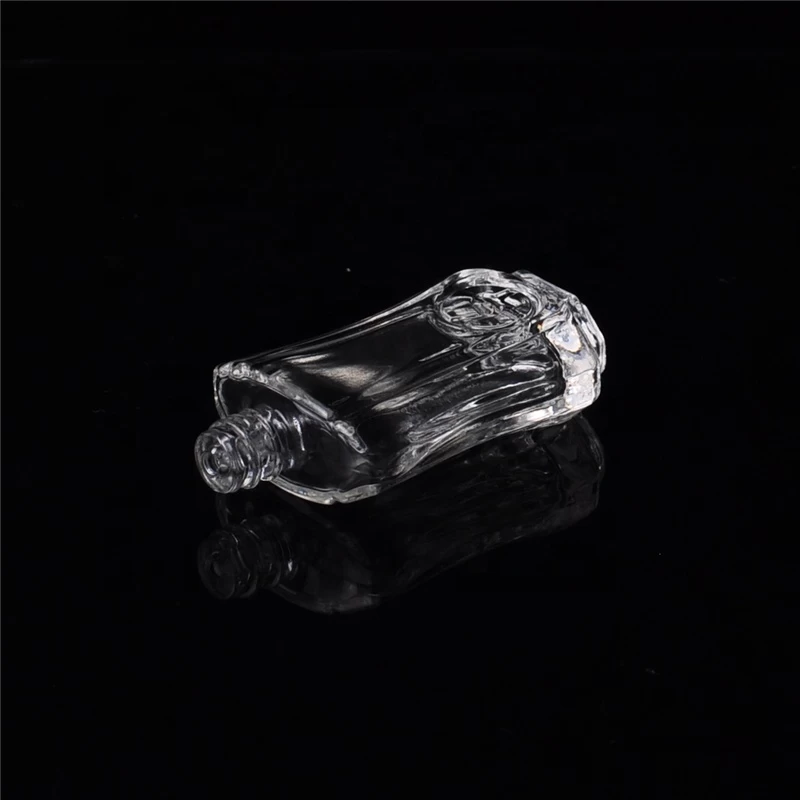 Mini empty glass container embossed oil perfume bottles supplier