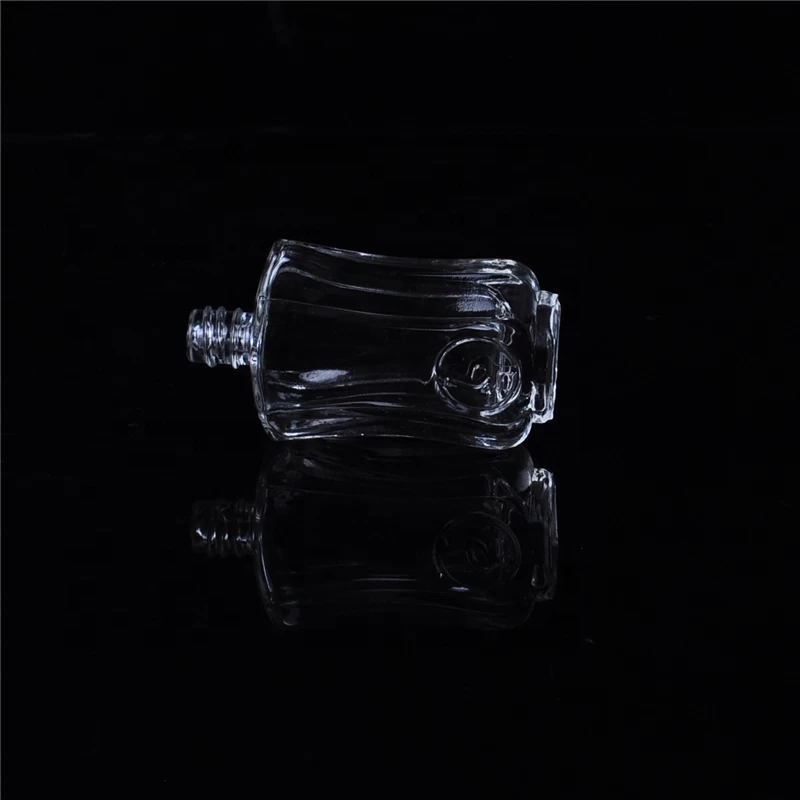 Mini empty glass container embossed oil medicine bottles supplier