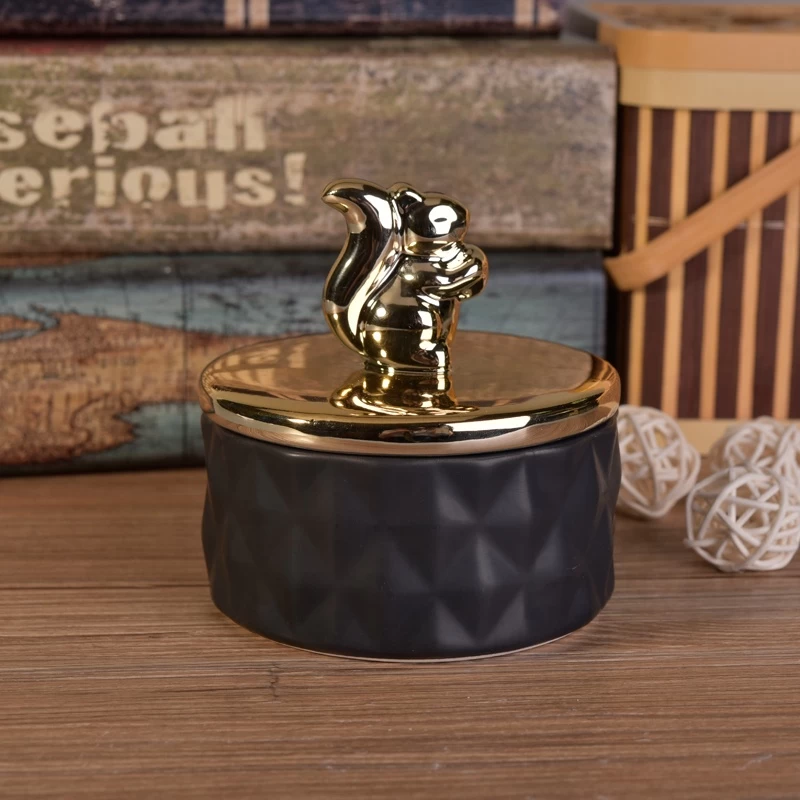 Black ceramic candle container with golden lid for home decor