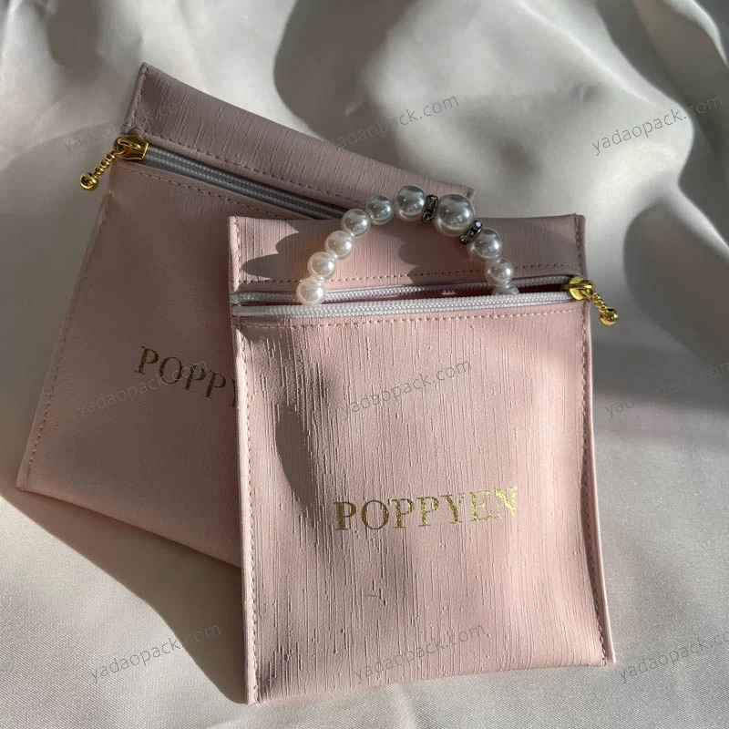China customize zipper pu leather bag jewelry pouch packaging pink pu leather pouch jewelry pouch bag manufacturer