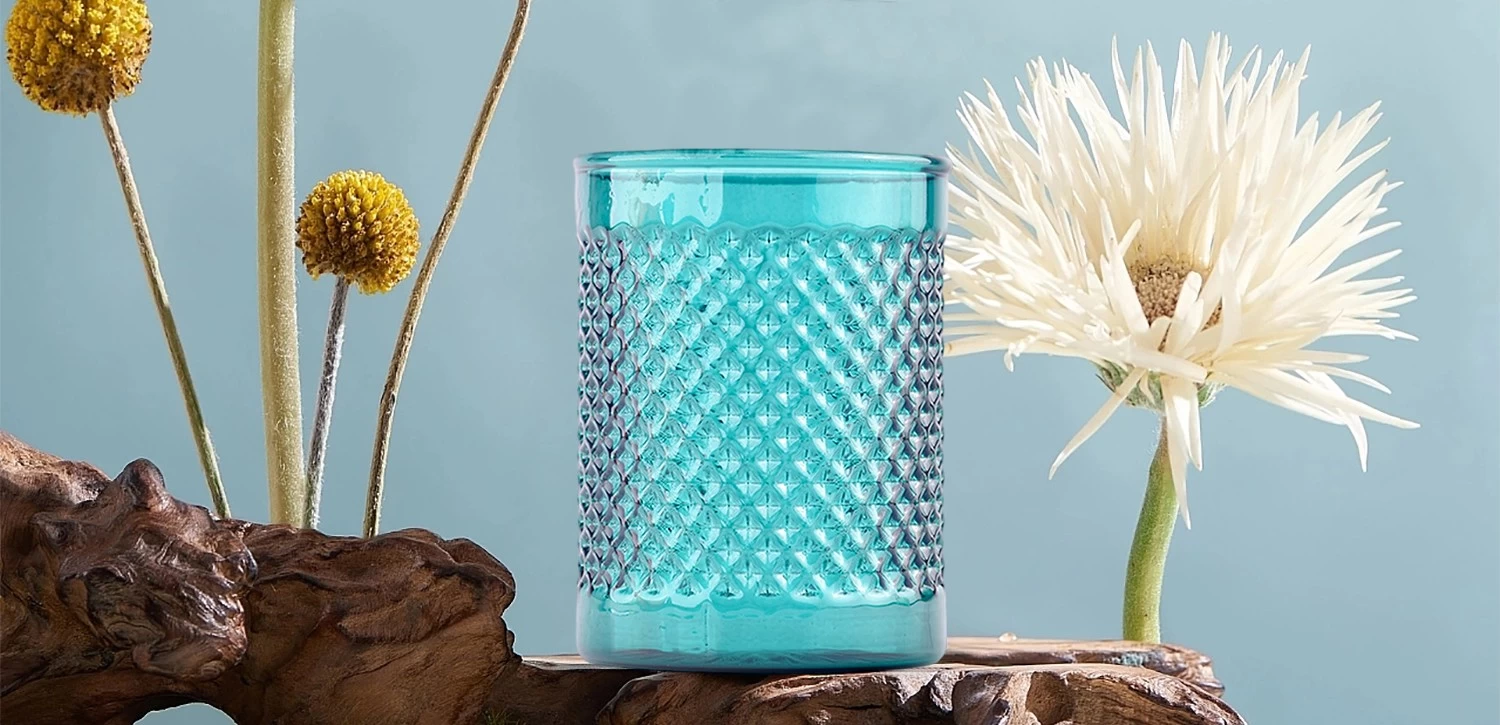 Modern custom recessed green glass candle jar with grain pattern