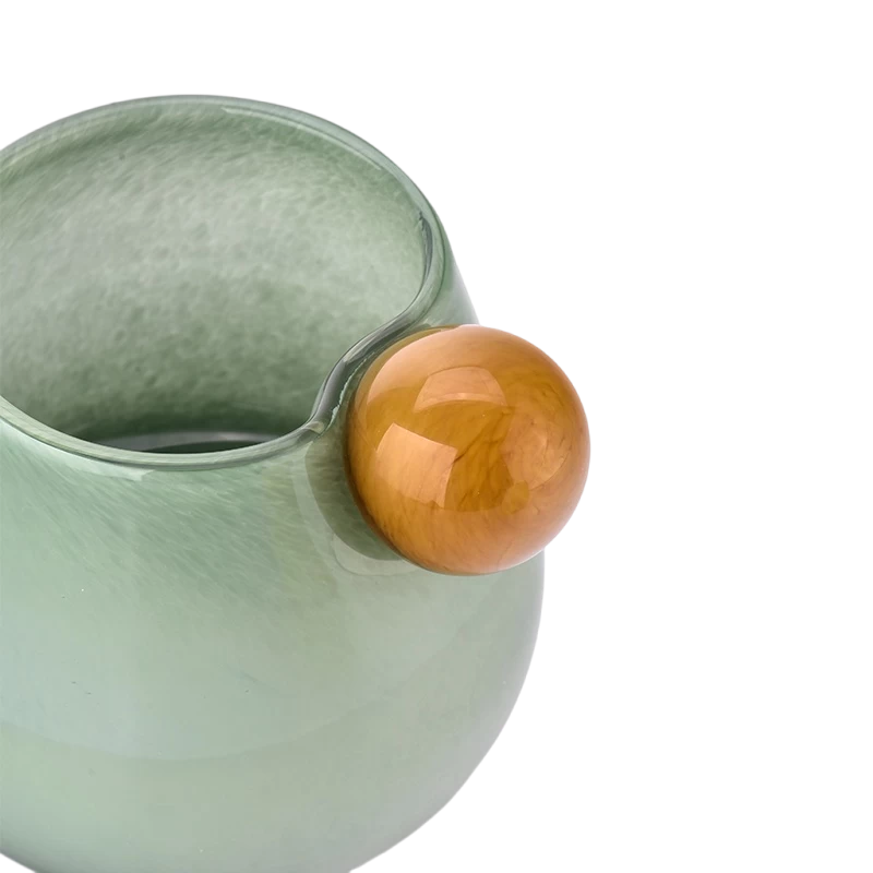 China Newly designed home decor green glass candle holder with ball handle manufacturer