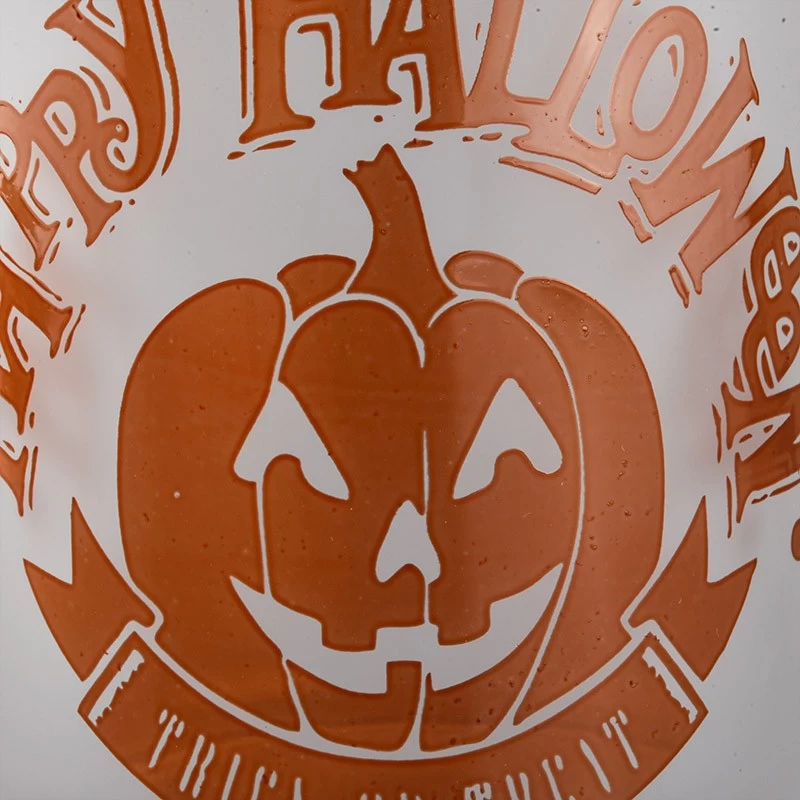 China Wholesale frosted pumpkin Halloween pattern glass candle jars manufacturer
