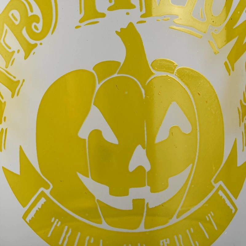China Custom frosted yellow pumpkin Halloween pattern glass candle jar candle holder decoration manufacturer