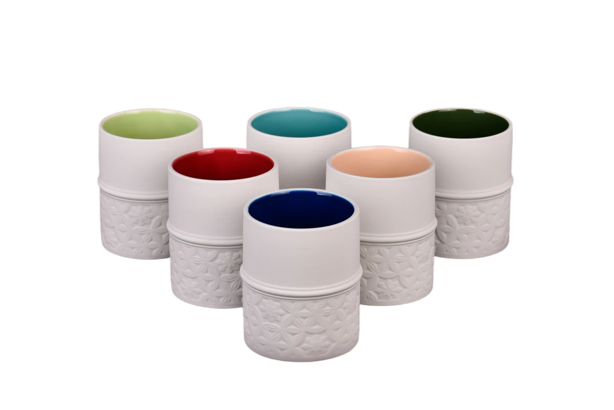 Wholesale three-dimensional carved ceramic candle jars with lids for home decoration containers