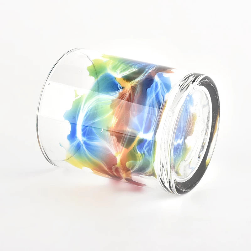 clear glass candle vessel with beautiful painting