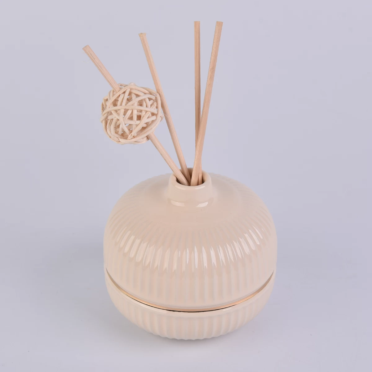 round ceramic bottle in nude color with gold ring, ceramic diffuser bottles