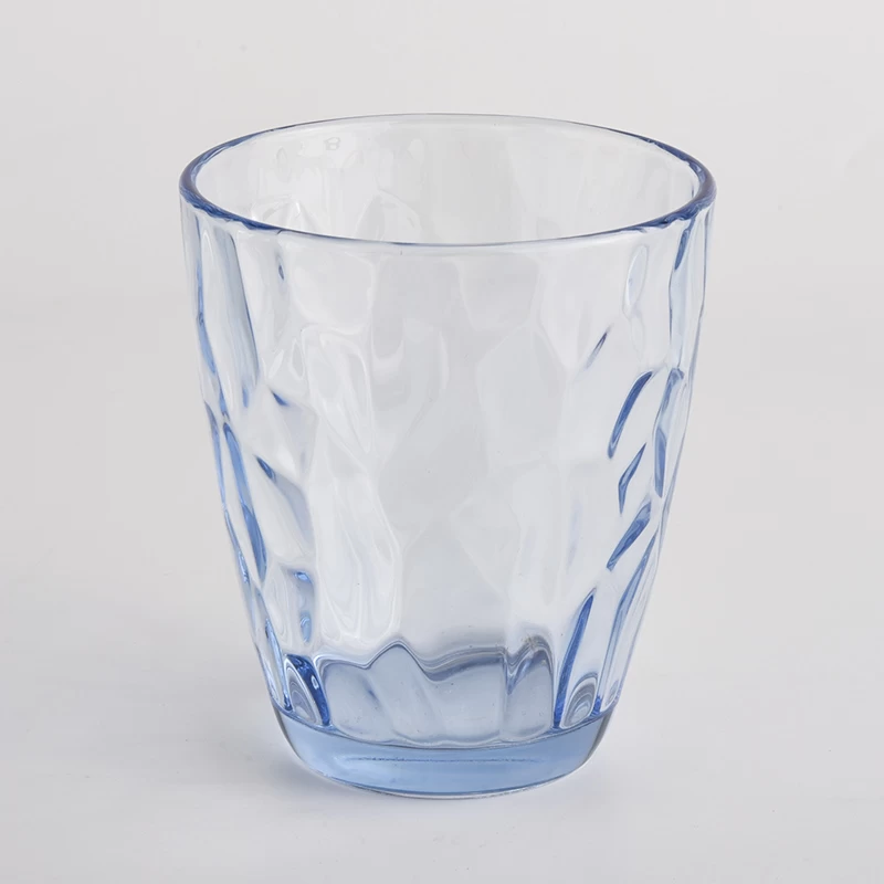 transparent blue glass candle holders with knock patterns