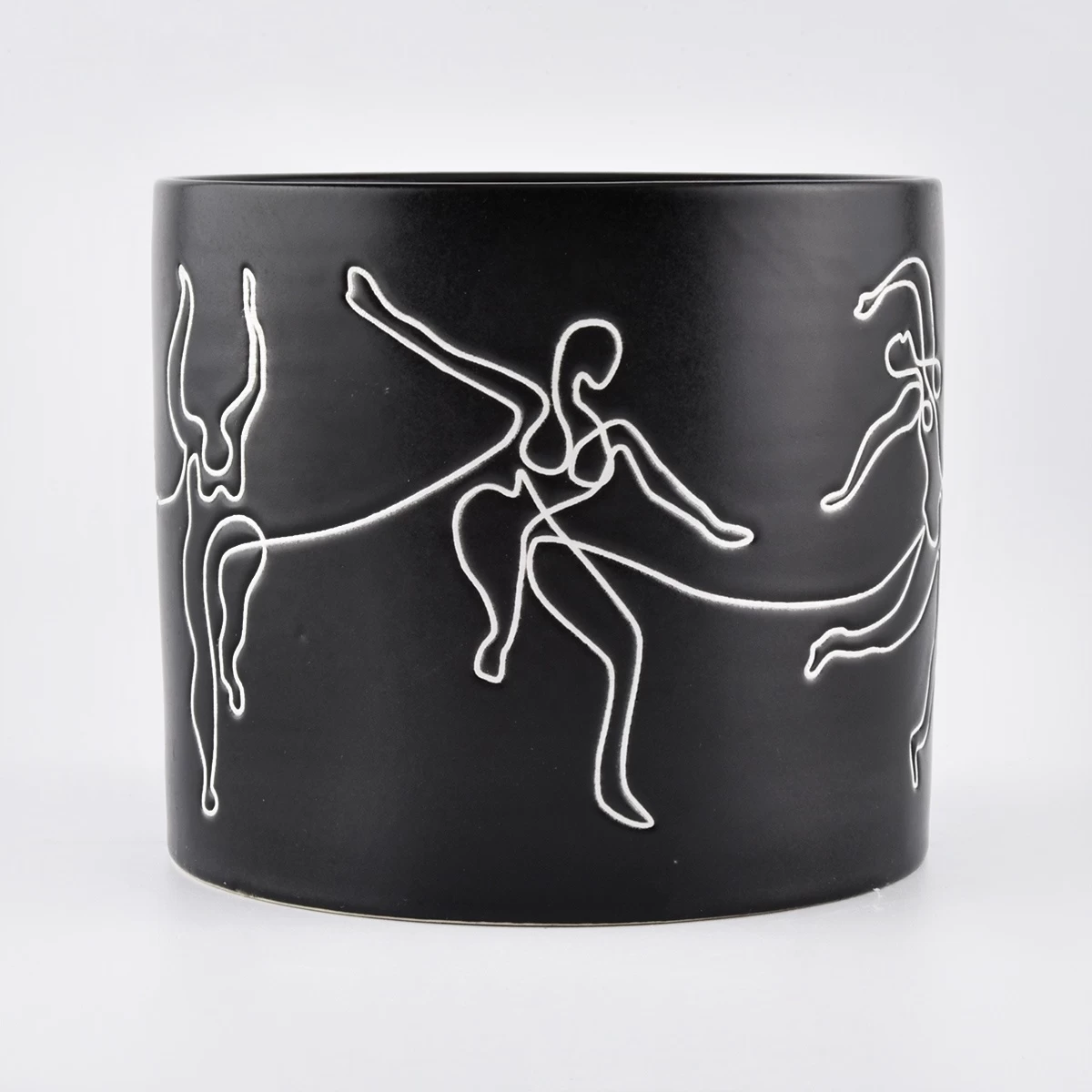 black ceramic candle jars with white printing