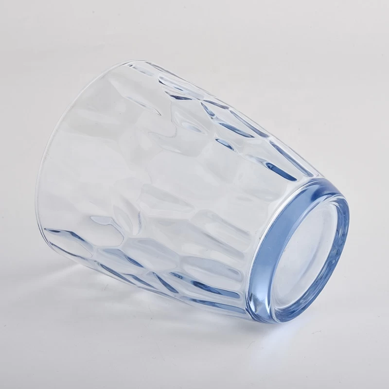 transparent blue glass candle holders with knock patterns