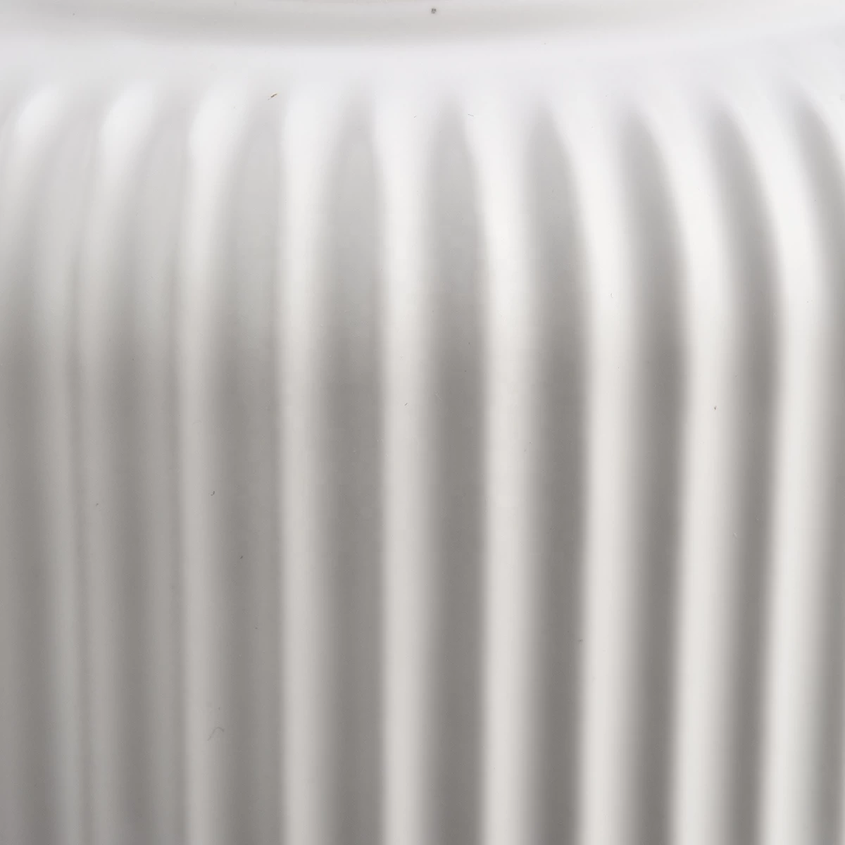 matte white glazed ceramic candle jars with stripe designs