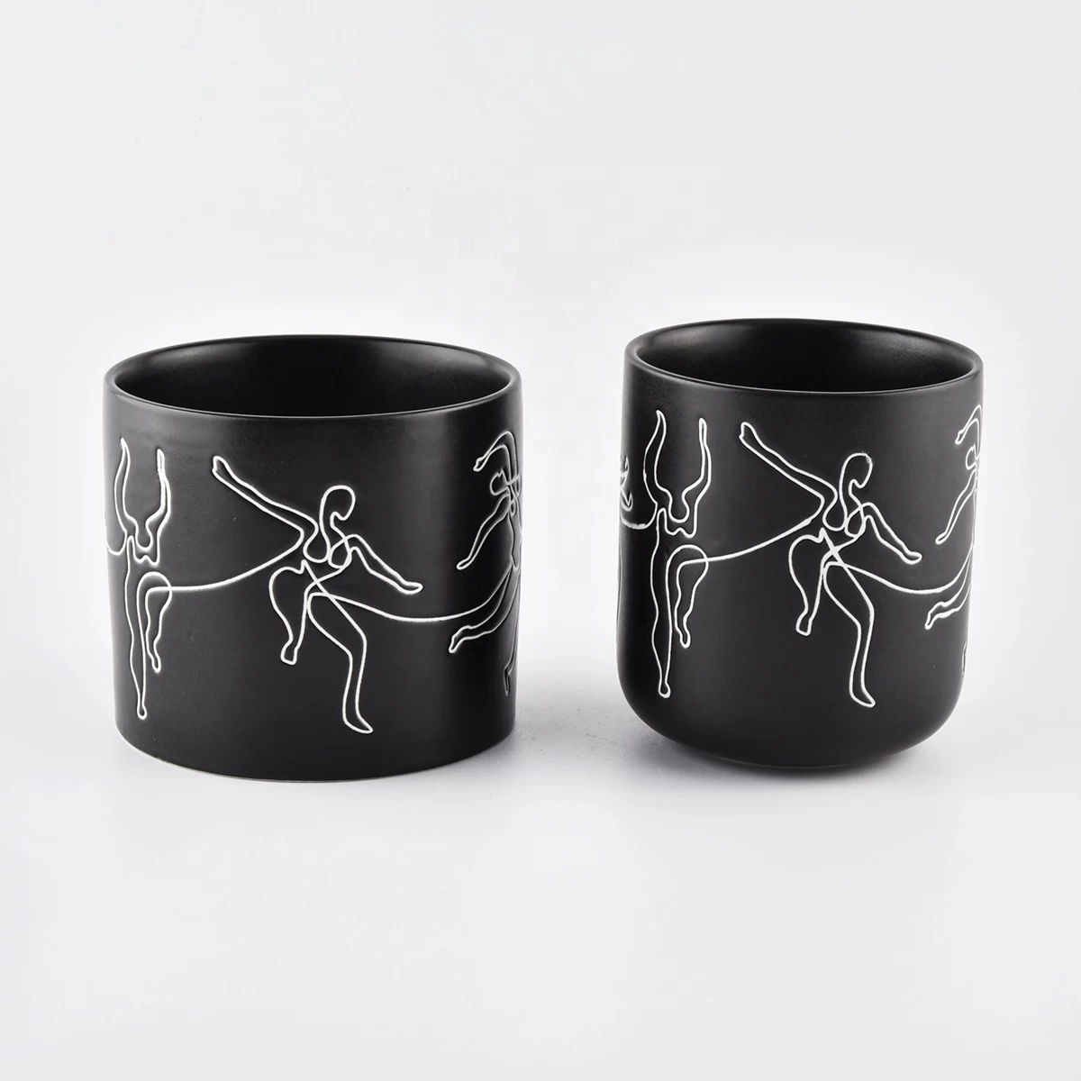 black ceramic candle jars with white printing