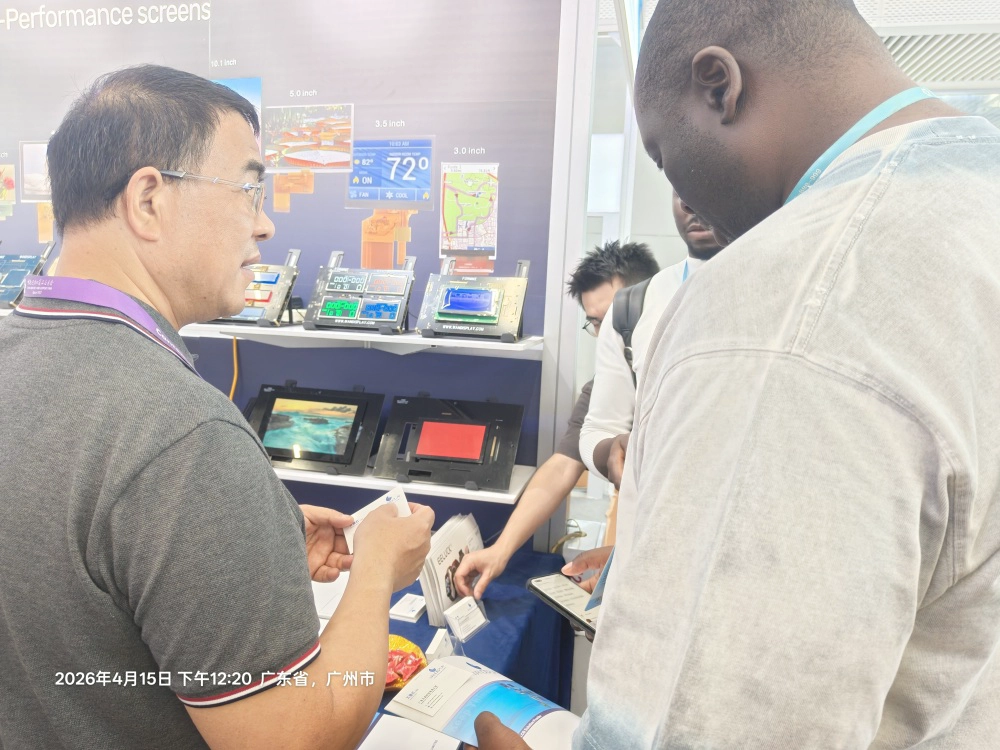 Buyers reviewing LCD display specifications at Canton Fair