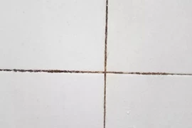 Why do some people look black when they make grout