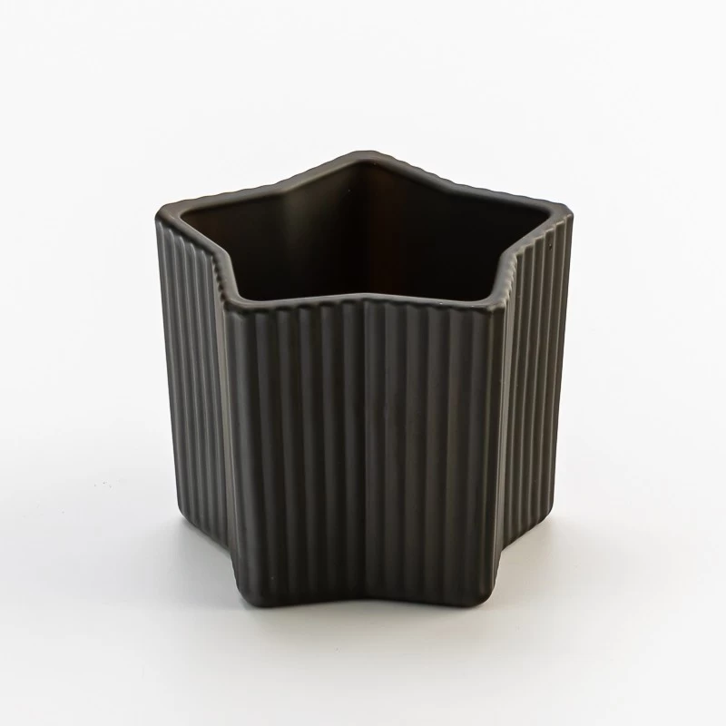 China Popular matte black glass candle jar with star design manufacturer