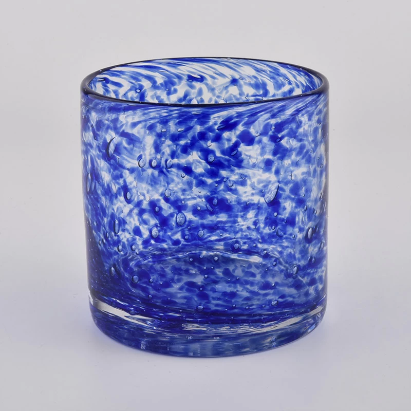Mouth blown glass candle vessels with colorful decoration