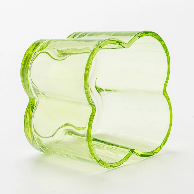 Popular green color glass candle vessel with flower design