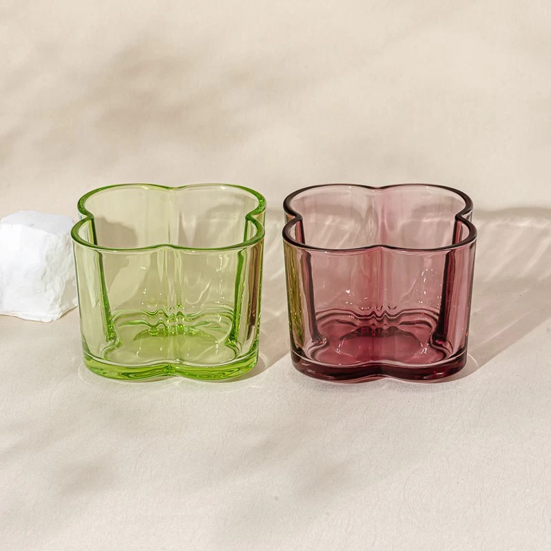 Popular green color glass candle vessel with flower design
