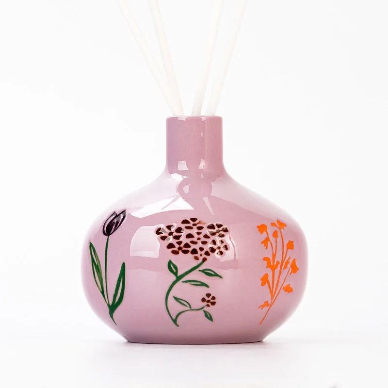 Wholesaling Fancy Pattern Pink Glazed Aroma Ceramic Bottle for Fragrance
