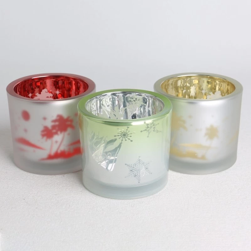 China electroplated laser hollow pine tree pattern frosted glass candle jar manufacturer