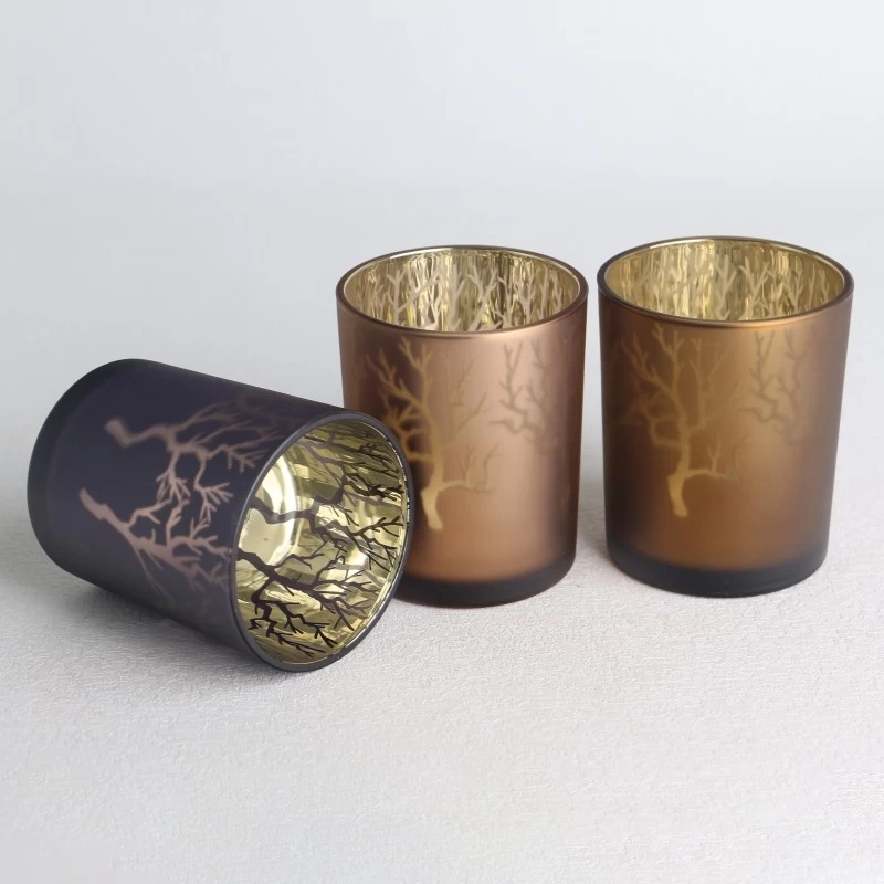 porcelana Tarro de vela de vidrio esmerilado con patrón de ramas huecas con láser galvanizado fabricante