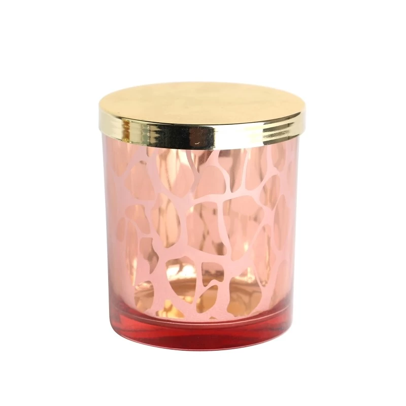 China electroplated laser hollow pattern pink glass candle jar scented candles with golden lid manufacturer