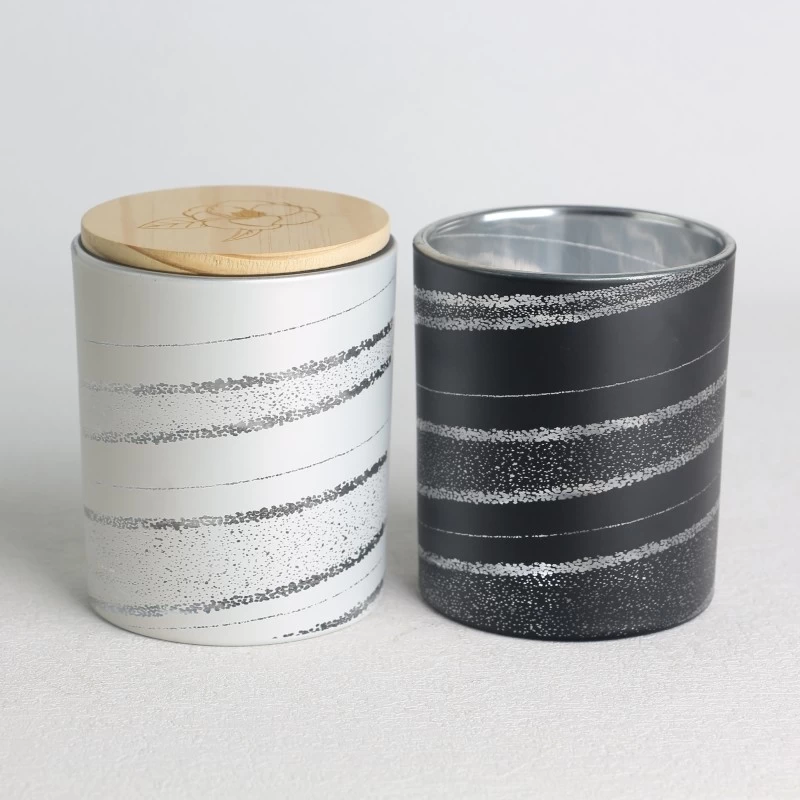 China spray color opaque laser hollow pattern black and white glass candle jar scented candles with wooden lid set manufacturer