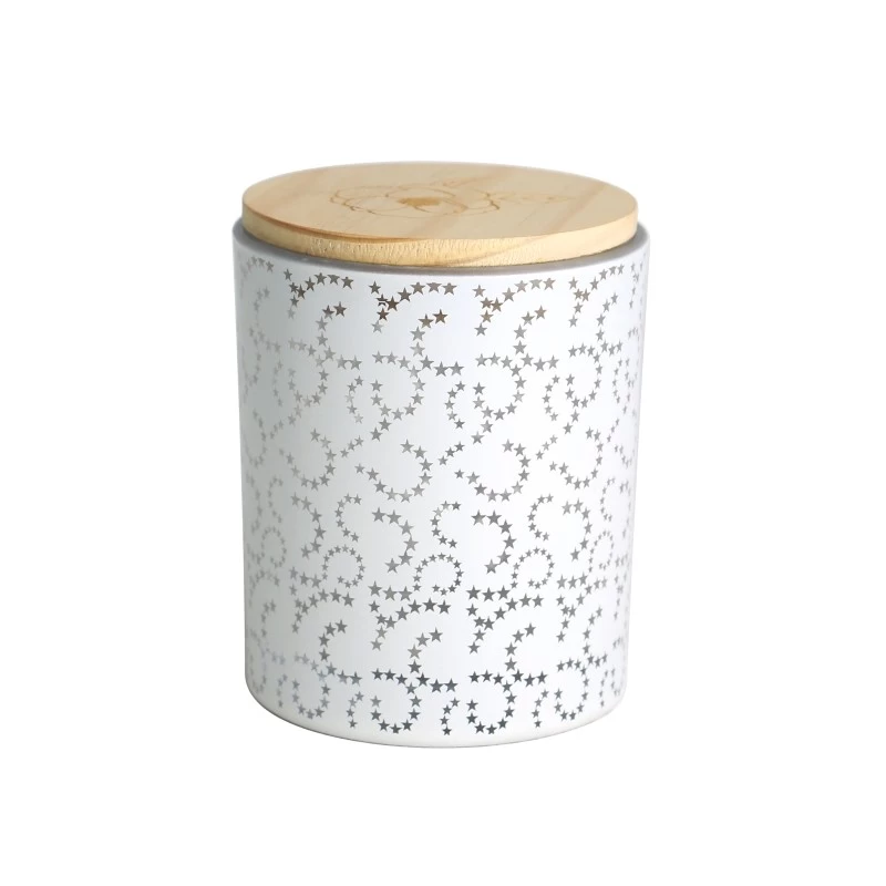 China spray color opaque laser hollow pattern white glass candle jar scented candles with wooden lid manufacturer
