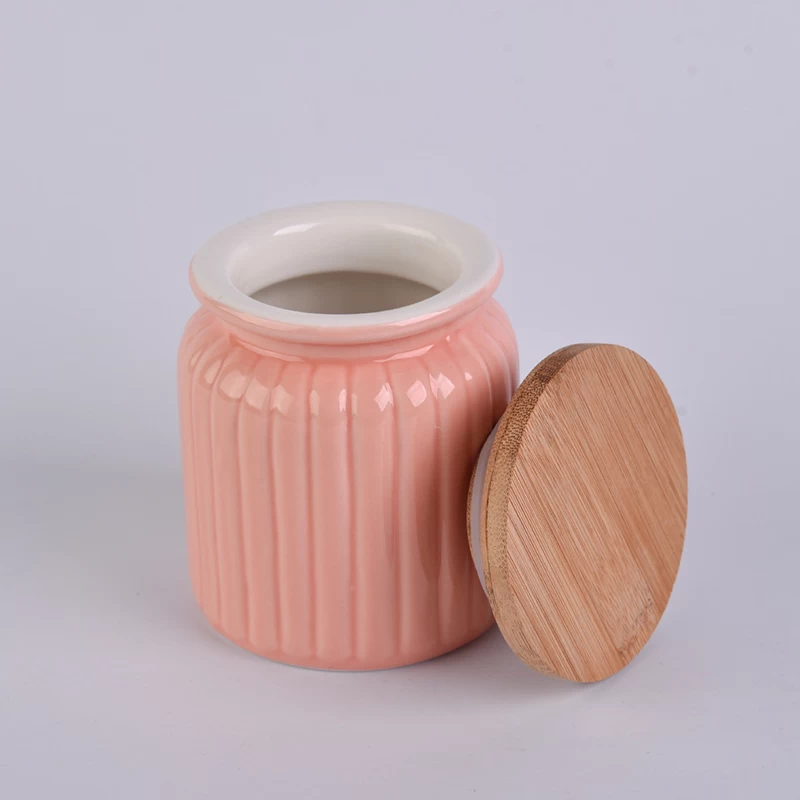 pot à bougie en céramique orange avec couvercle en bambou